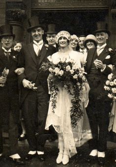 an old black and white photo of a wedding party