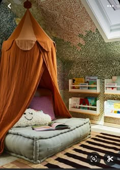 a canopy bed in the corner of a room with bookshelves and shelves on either side