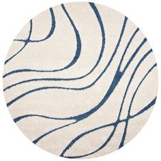 a white and blue rug with wavy lines on it