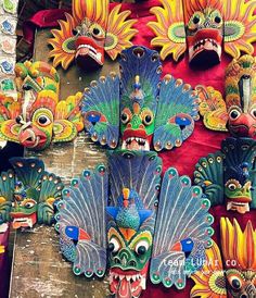 colorful masks are hanging on the wall