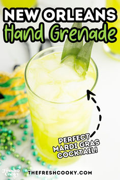 Tall glass filled with a bright yellow-green festive Mardi Gras cocktail.