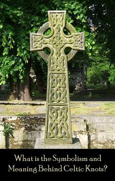 an old stone cross in the middle of a park