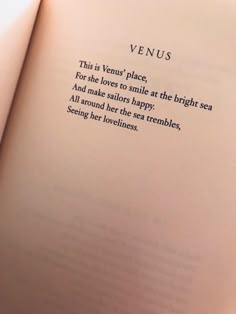 an open book with the words venus written in cursive writing on top of it