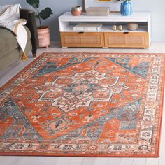 an orange and blue rug in a living room