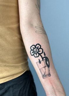 a person with a flower tattoo on their arm