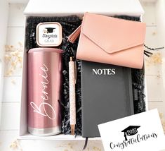 an open box containing a notebook, notepad, pen and wallet with the words notes written on it