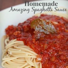 spaghetti with tomato sauce and basil leaves on top is featured in this recipe for homemade amazing spaghetti sauce