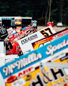 many racing cars are lined up on the track