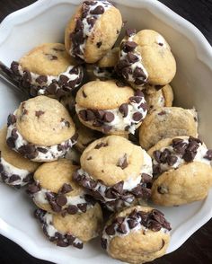 a white bowl filled with cookies and chocolate chips