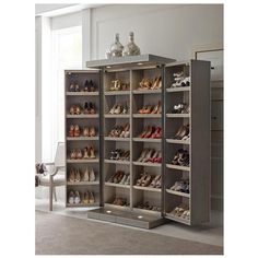 a large closet with many pairs of shoes in it