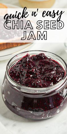 a jar filled with jam sitting on top of a table