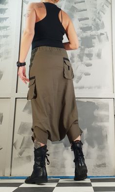 Khaki Ankle-length Pants With Belt Loops, Khaki Trousers With Belt Loops, Khaki Cargo Bottoms Ankle-length, Khaki Stretch Cargo Pants, Baggy Khaki Bottoms With Elastic Waistband, Khaki Ankle-length Pants With Cargo Pockets, Summer Full-length Harem Pants With Pockets, Baggy Ankle-length Parachute Pants With Hip Pockets, Stretch Ankle-length Cargo Bottoms