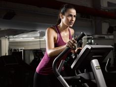 a woman on a treadmill in a gym