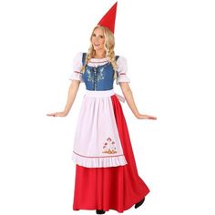 a woman in a red and white dress with a gnome hat on her head is posing for the camera