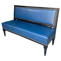 a blue leather bench with silver trim on it