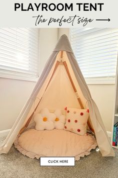 a teepee tent with pillows on it and the text playroom tent the perfect size