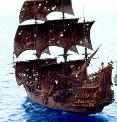 an old pirate ship sailing in the ocean