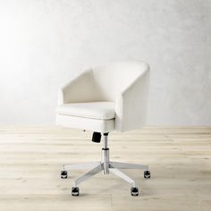 a white office chair sitting on top of a hard wood floor