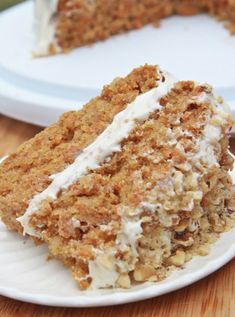 a piece of carrot cake on a white plate