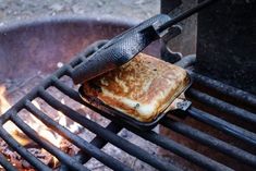 grilled food being cooked over an open fire