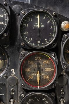 an old airplane cockpit with multiple gauges and dials