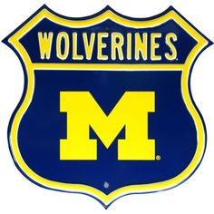 a blue and yellow sign with the word wolverines on it's back side