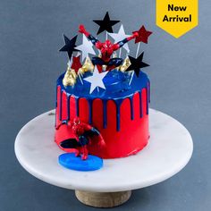 a red, white and blue cake with stars on top