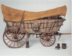 an old fashioned wooden wagon with two wheels