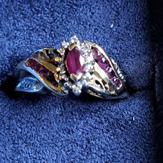 a close up of a ring on a blue carpeted floor with other items in the background