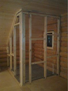 the inside of a log cabin that is being built