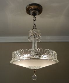 a chandelier hanging from the ceiling in a room