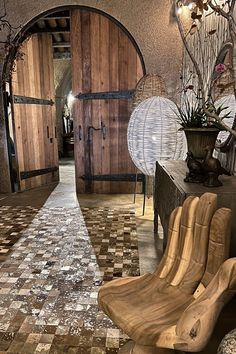 a wooden chair sitting on top of a tiled floor