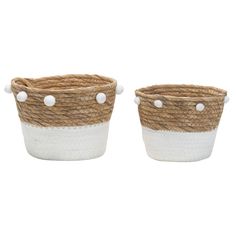 two white and brown baskets sitting next to each other