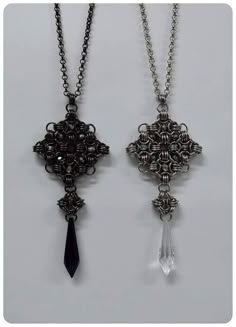 two necklaces that have been made to look like cross pendants