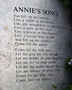 a memorial stone with the words annie's song written on it