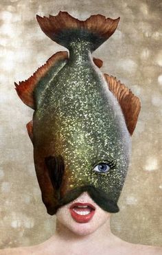 a woman with a fish mask on her head