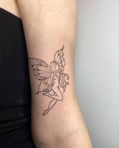 a woman's arm with a small tattoo design on the left side of her body