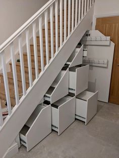 an under stair storage unit with drawers underneath