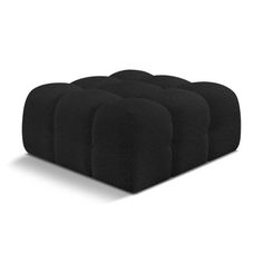 four black cushions sitting on top of each other