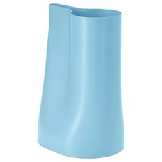 a blue vase sitting on top of a white table