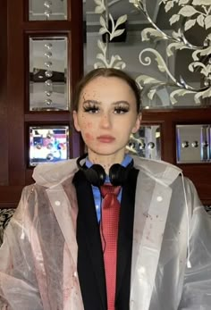 a mannequin dressed in plastic and wearing headphones