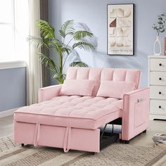 a pink futon sofa bed in a living room