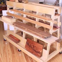 a wooden shelf with several pieces of wood on it's top and bottom shelves