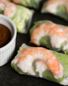 shrimp spring rolls with dipping sauce on the side