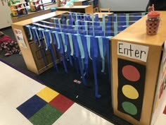 an open classroom door with blue ribbon hanging from it's sides and the words enter