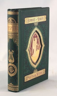 a green book with gold lettering and an image of a horse on the front cover