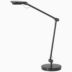 a black desk lamp on a white background