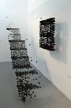 an abstract sculpture is shown in the middle of a room with white walls and flooring