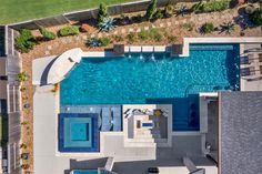 an aerial view of a swimming pool and patio