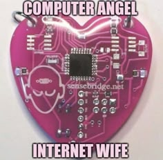 a pink heart shaped computer chip with the words computer angel written in white on it